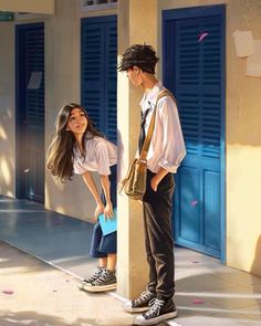 a boy and girl standing next to each other in front of blue shuttered doors