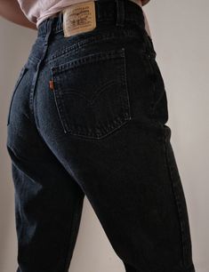 "Women's Vintage Levi's Jeans Orange Tab Black Denim SKU: OT L BLK 4 Made in Canada 100% Cotton high quality non stretch denim Waist snatching high waisted fit Curves beautifully around the hips Tapered straight leg Levi's Orange Tab ( has a similar fit to Levi's 512 ) YKK Zipper and Single Button Closure Stunning Dark Black Wash Item is in excellent Vintage condition with no significant flaws to note About the Fit: Model is 5,7\" and usually wears a modern women's size S - M, US 4 - 6, 28. The Fitted Washed Black Jeans With Pockets, Classic Black Jeans With Pockets, Classic Black Rigid Denim Bottoms, Fitted Washed Black Rigid Denim Bottoms, Fitted Rigid Denim Bottoms In Washed Black, Classic Fitted Washed Black Bottoms, Classic High Waist Washed Black Bottoms, Classic High-waist Washed Black Bottoms, Vintage Black Jeans With Pockets