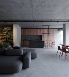 a living room filled with furniture next to a kitchen and dining area on top of a gray floor