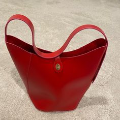 Brand New Without Tags Elizabeth Arden Red Vegan Leather Bucket Bag Single Shoulder Strap And A Flap And Gold Twist Closure. 14” Tall X 12” Wide. Strap 20” Long Red Rectangular Bucket Bag With Large Capacity, Red Rectangular Large Capacity Bucket Bag, Red Large Capacity Rectangular Bucket Bag, Red Rectangular Hobo Bag With Large Capacity, Trendy Red Hobo Bag For Everyday, Trendy Red Bucket Bag For Shopping, Tan Bucket Bag For Errands, Large Capacity Red Rectangular Hobo Bag, Chic Red Bucket Bag With Large Capacity