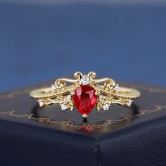 Natural Ruby 18K Yellow Gold Ring Luxury Engagement Ring For Women Handmade Red Gemstone Ring Natural Diamond Ring Gifts For Her ----The Ring Details---- * Gem Stone: Natural Ruby * Gem Stone Size: Pear Cut 4*5.3mm * Gemstone Total Weight:  Approx 0.5ct * Side Stone: Natural Diamond * Diamond Clarify: VS1 * Diamond Colour: G-F * Side Stone Total Weight:  Approx 0.05ct * Material: K Solid Gold / Platinum * Band Width: 1.6mm * Want to know more details? Please contact me. ----Others Information---- ✦ Guaranteed Purchase: - 14 Day Refund Guarantee; - Excellent Customer Service; - Free Transportation and insurance to All Parts Of The World; - Free Gift Box & Packing ✦It is my honour to design ring for you :) I accept custom making service. Please contact me if you need it.  ✦Please allow 2-3 w Red Open Diamond Promise Ring, Red Ruby Open Ring Jewelry, Red Open Ring Fine Jewelry, Red Open Ring For Promise, Elegant Red Ruby Open Ring, Fine Jewelry Red Ruby Ring, Fine Jewelry Gold Crystal Ring With Ruby, Red Ruby Gemstone Rings, Elegant Red Crystal Gemstone Ring