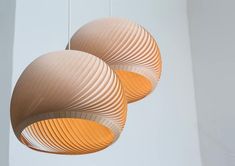 two circular light fixtures hanging from the ceiling