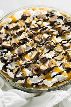 a dessert dish with marshmallows, chocolate sauce and whipped cream on top