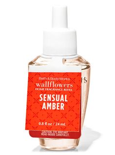 a bottle of wallflowers hand sanitizer with an orange label on it