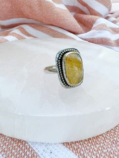 Tap into your inner creative when you slip on this Citrine ring. Draw new opportunities and wealth in with Citrine, otherwise known as the stone of abundance. It is also the stone of creativity, allowing you to work with the divine power within and birth your best ideas. The Deets Handcrafted from .925 sterling silver, this ring features a flashy Citrine stone and sterling silver details. The ring is a size 9 3/4. Need help finding your ring size? ANBE Designs now carries ring sizers! Prior to b Divine Power, Seed Collection, Citrine Stone, Citrine Ring, The Divine, New Opportunities, Best Ideas, Citrine, Tap