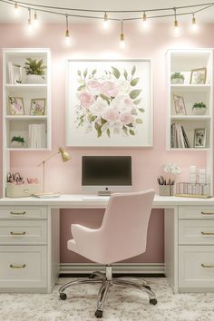 an office with pink walls, white desks and gold accents on the shelves is decorated with flowers