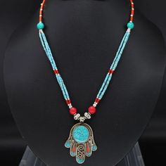 Beautiful Handmade Ethnic Statement Necklace. Tibetan Silver With Turquoise And Indian Coral. Handmade With Traditional Design With Hamsa Fatima. Will Be Energetically Charged By A Reiki Master Handmade Turquoise Traditional Necklace, Traditional Handmade Turquoise Beaded Necklaces, Handmade Traditional Turquoise Necklace, Traditional Blue Turquoise Necklace For Festivals, Handmade Turquoise Beaded Necklace For Festivals, Handmade Traditional Turquoise Necklace For Festivals, Traditional Turquoise Necklaces With Colorful Beads, Traditional Turquoise Necklaces For Festivals, Traditional Adjustable Turquoise Necklace