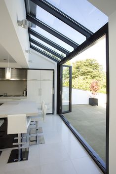 an instagram photo of a kitchen and dining room with skylights on the ceiling