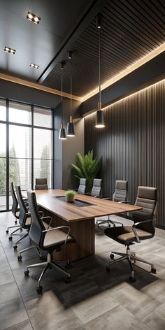 an empty conference room with chairs and a large wooden table in the middle of it