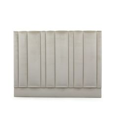 an upholstered headboard with pleated panels on the top and bottom panel