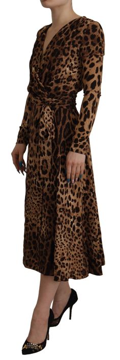 DOLCE & GABBANA Gorgeous brand new with tags, 100% Authentic DOLCE & GABBANA stretch wrap dress features v-neckline with back zip closure, waist belt and long sleeves. Model: A-line Maxi dress Color: Brown Zipper closure Logo details Made in Italy Material: 95% Viscose 5% Elastane