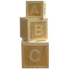 three wooden blocks with the letters abc and c on them, all stacked up together