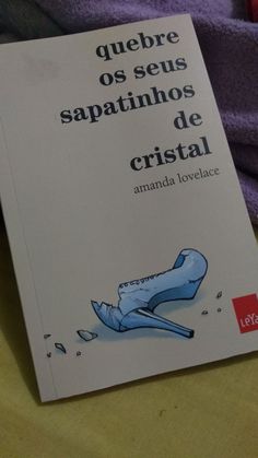 a book with spanish writing on it sitting on a bed next to a purple blanket