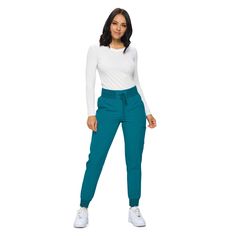 PRICES MAY VARY. RIBBED KNIT WITH DRAWSTRING CLOSURE- This jogger combines the comfort of a soft knit waistband and stability of an added drawstring. 6 ROOMY POCKETS- Our scrub joggers come with all the pockets you need including 2 back, 2 cargo, and 2 hip pockets. BREATHABLE STRETCHY MATERIAL- These scrub pants are made from a material engineered to be durable, breathable and flexible. PETITE AND REGULAR SCRUB JOGGERS- When it comes to scrub joggers the length is key- you deserve scrubs that fi Stretch Pants With Ribbed Cuffs, Green Stretch Pants With Ribbed Waistband, Sports Bottoms With Stretch And Ribbed Cuffs, Stretch Bottoms With Ribbed Cuffs For Sports, Stretch Full Length Joggers For Fall, Fall Stretch Full-length Joggers, Fall Stretch Full Length Joggers, Fitted Sweatpants With Ribbed Cuffs, Fitted Pants With Ribbed Cuffs