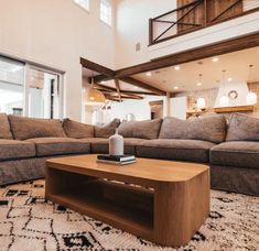 a living room with couches and a coffee table