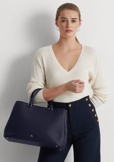 Whether you wear it to work or while running errands, the large Hanna satchel features a sleek, spacious silhouette with a myriad of pockets for storing your necessities. Punctuated with a polished LRL logo, this style is rendered in crosshatch leather for subtle texture and a sophisticated sensibility. Two top handles, each with a 4.5" drop Removable, adjustable crossbody strap with a 16.75" maximum drop length Polished "LRL" metal logo at the front Exterior slip pocket Zip pocket and a slip po Classic Navy Shoulder Bag With Double Handle, Blue Leather Shoulder Bag For Work, Blue Shoulder Bag With Detachable Handle For Work, Chic Workwear Satchel With Handles, Elegant Navy Everyday Satchel, Chic Satchel With Leather Handles For Work, Elegant Navy Satchel For Everyday Use, Elegant Blue Shoulder Bag For Work, Blue Workwear Bags With Leather Handles