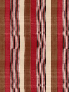 a red and brown striped rug with vertical stripes