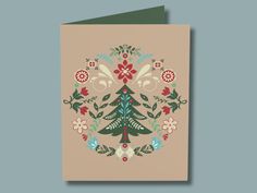 a card with a christmas tree in the center and holly wreath around it, on a beige background