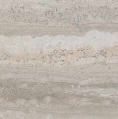 a close up view of some marble with white and gray streaks on it's surface