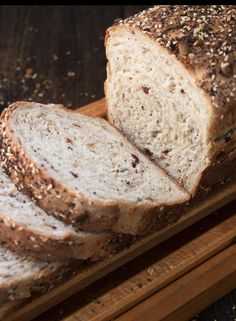 sliced loaf of bread sitting on top of a cutting board