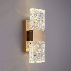 an image of a bathroom wall light with glass blocks on the front and back side