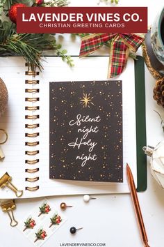 an open notebook with the words lavender vines co written on it next to christmas decorations