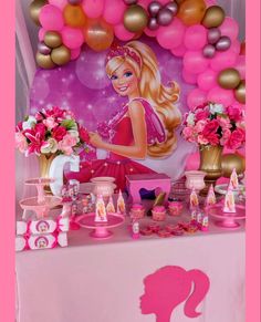 a barbie birthday party with pink and gold decorations