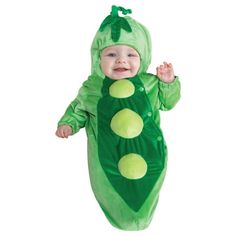 a baby dressed in a pea costume