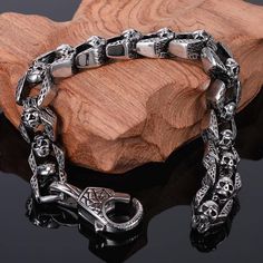 This very unique skull bracelet is crafted out of Stainless Steel in a unique pattern. This Bracelet is especially thick, heavy, and well-made. Don't be fooled by our low price! this bracelet is top quality!✔ Condition: 100% Brand New and High Quality✔ Made of 316L Stainless Steel✔ Size: 8.7 in L x 0.5 in W (22 cm L x 12 mm W)✔ Weighing in at an impressive around 2.6 ounces (75 grams)✔ Packaging comes in a gift bag✔ Silver color look Gothic Stainless Steel Skull Bracelets, Gothic Skull Print Bracelets As Gift, Halloween Skull Bracelets With Skull Print, Skull Bracelet Men, Masculine Jewelry, Gothic Jewellery, Mens Chain Bracelet, Beautiful Anklet, Men's Bracelets