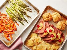 two pans filled with food next to each other on top of a white counter