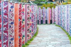 a row of colorfully painted wooden fences