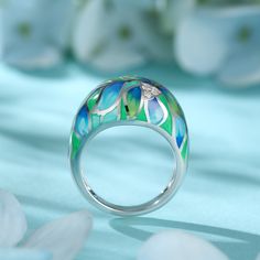 How beautiful is this sweet spring ring? The ring features flowers and leaves that wrap around your finger, detailed with bright enamel for lovers of colour! The perfect accessory for spring and summertime, or to keep the floral vibe going all year round.Carat Weight: 0.072 ctStone Size: 1.4 mmNumber of Stones: 3 Stone Shape: RoundStone Color: Diamond WhiteWeight: 4.79 gWidth: 3.7 mmHeight: 7.7 mmThickness: 1.6 mmMaterial: 925 SilverPlating Color: Silver Elegant Green Enamel Ring, Enamel Jewelry For Spring Gifts, Spring Enamel Jewelry As Gift, Spring Enamel Jewelry For Gifts, Spring Gift Enamel Jewelry, Green Rings As Summer Gift, Green Rings Suitable For Summer Gifts, Elegant Hand Painted Enamel Ring, Green Rings For Summer Gifts