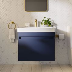 a bathroom with a sink, mirror and toilet paper dispenser on the wall