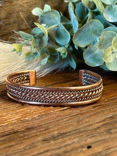 This exquisite twisted rope design Copper Cuff Bracelet was made by Navajo Silversmith Elaine Tahe. This bracelet would make the perfect gift for a friend or spouse for any special occasion! ★Specifics★ Metal: Copper Size of Bracelet:  As the piece sets it will fit up to a 6 1/4" wrist and can be slightly adjusted up or down. Gap: 1 1/4" Width: 1/2" Weight of Bracelet: 24g Hallmarked: Not Hallmarked which is common with this artist ★  Free shipping on all orders! We ship with UPS and always include tracking. All orders ship within 2 days of payment. ★  Returns are accepted within 7 days in the ORIGINAL condition and product packaging.  Buyer is responsible for return shipping costs as well as any loss in value of item. Lone Star Turquoise is not responsible for any lost packages upon retur Adjustable Copper Bohemian Braided Bracelet, Adjustable Copper Braided Bohemian Bracelet, Adjustable Bohemian Copper Braided Bracelet, Bohemian Braided Bangle Jewelry, Nickel Free Adjustable Southwestern Cuff Bracelet, Bohemian Braided Bracelet Jewelry, Adjustable Rustic Bangle Cuff Bracelet, Rustic Adjustable Bangle Cuff Bracelet, Bohemian Adjustable Nickel-free Cuff Bracelet