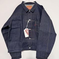 Levi's 506xx LVC First Size 46 T-back Denim Jacket Made in Japan Description LEVI'S (LVC) Levi's Vintage Clothing Made in Japan TYPE I JACKET 1936 506XX 1st type denim jacket ORGANIC 70506-0028 [Reprint] ◆New and unused ◆Size 46 T-back 46(XXL) Shoulder width 56cm Width 64cm Length 66cm Sleeve length 66cm ◆ This is a very popular denim jacket that is sold out due to limited availability. This item is difficult to obtain. ■TYPE I JACKET 1936MODEL ◉MADE IN JAPAN ◉Commonly known as “first” model denim jacket ◉12.7oz Red line selvedge denim (selvedge placket lining) ◉100% organic cotton ◉Chest pocket with flap (1 pocket) ◉Double pleats + box stitch on the front ◉Cinch back ◉Inward action pleats on the back ◉Two-horse leather patch with XX mark ◉Button with company name engraved ◉Copper punching Levis Lvc, Box Stitch, Levis Vintage Clothing, Red Line, Selvedge Denim, Leather Patches, Vintage Levis, Vintage Clothing, Chest Pocket