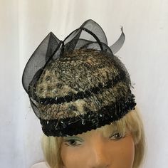 "Vintage Black Bowl Style Hat Covered by Fabric, Fibers and Sequins. Large Black Horsehair Bow. Black and Cream Background. Chin Strap. Fancy Hat. This hat is in good shape for its age. Wear for a wedding. Size: 7\" X 10\" With Bow, 22 1/2\" For other vintage and homemade items see: www.VeryVictorianStudio.etsy.com For sewing related items see my other shop: www.SewingRoomStore.etsy.com Thank you for looking!" Black Fitted Fascinator For Evening, Fitted Black Fascinator For Evening, Black Cloche Mini Hat For Evening, Black Cloche Fascinator For Party, Black Fascinator For Evening, Black Cloche Fascinator For Evening, Vintage Black Fascinator For Party, Black Evening Cloche Fascinator, Black Cloche Mini Hat