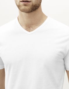 The v neck t shirt is the ultimate understated essential, simple and classic. We stay true to our ethos of comfort and quality with this luxury version. This v neck has been expertly crafted with the finest materials and meticulous attention to detail for an unmatched distinctive style that will look even better with age.

Crafted from our premium lightweight jersey fabric — superfine two-fold (80/2) yarn made from the finest extra long staple Peruvian Pima cotton.

We recommend that you take yo Classic V-neck Relaxed Fit T-shirt, White V-neck T-shirt For Everyday, Modern White V-neck Top, Modern Solid Color V-neck Tops, Elegant White T-shirt For Everyday, Classic V-neck T-shirt With Relaxed Fit, Classic V-neck T-shirt In Relaxed Fit, Stay True, The Men