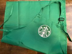 Starbucks apron please select the size that you need Adult will fit teen to adult but these are made for adult sizes. If you have concerns about sizing, please message me or even take a look at the pictures in the review section.  All aprons feature a front pocket, adjustable neck strap, and tie waist straps. I offer a matte finish or glitter finish for the logo Starbucks Apron / starbucks costume / starbucks logo / starbucks apron costume / starbucks costume child / Starbucks adult costume / Starbucks Costume, Starbucks Apron, Costume Capes, Starbucks Logo, Neck Strap, Adult Costumes, Fjallraven Kanken Backpack, Costume Accessories, Front Pocket