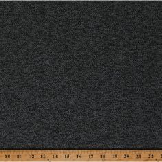 a ruler is next to a black fabric