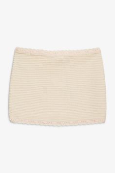 Live la vita bella in the For Love & Lemon's Kelsey cream crochet mini skirt—a low rise knit mini skirt with nostalgic appeal. Featuring a grosgrain ribbon running through the waist and hem, and a rosette and bow and the waist, this cream mini skirt will keep you feeling sexy and cute all season long. Pair it with the matching Olina Crochet Top. Self: 50%Polyester/ 50%Cotton; Lining: 80% Nylon/ 20% Spandex Eco Dry Clean recommended. Avoid cleaners that use harmful chemicals like "Perc". Lined Sc Spring Mini Skirt With Crochet Trim, Fitted Beige Bottoms With Crochet Trim, Feminine Fitted Cream Mini Skirt, Fitted Feminine Cream Mini Skirt, Summer Mini Skirt With Crochet Trim, Fitted Skirt With Crochet Trim, Fitted Cotton Skirt With Crochet Trim, Cream Mini Skirt, Crochet Mini Skirt