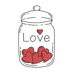 a jar filled with hearts sitting on top of a table