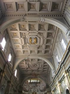 an ornate ceiling in a church with chandeliers