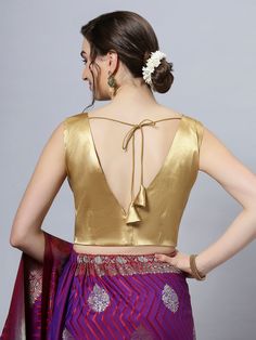 Item Type: Saree blouse / Crop top Product Features: Color: Gold Fabric: Cotton Satin Stretch Blend Trim: Back Tie Neck Style: V-Neck, Front & Back Sleeve Length: Sleeveless Closure: Back Hook Padded: No Disclaimer: There will be slight difference in digital to actual image Sleeveless Blouse For Saree, V Neck Sleeveless Blouse, Blouse Crop Top, Blouse Crop, Gold Satin, Innovative Fashion, Gold Fabric, Traditional Sarees, Crop Top Blouse