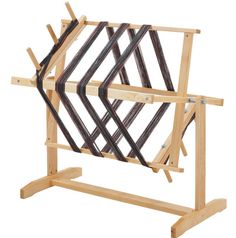 a wooden frame with multiple pieces of wood on it and two straps hanging from the back