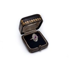 A former Art Deco ring from the 1920s.  Made of 0.585 yellow gold and 0.990 silver.  Central natural pink ruby weighing 0.40ct surrounded by diamonds with a total weight of 0.25ct (SI-VS)  Preserved hallmark for Hungary in the 1920s.  Item weight: 2.17g  Size: 15 - correction possible Collectible Ruby Ring With Diamond, Antique Diamond Sapphire Ring, Heirloom Ruby Ring With Diamond, Antique Sapphire Ring With Diamonds, Heirloom Ruby Diamond Ring, Art Deco Diamond Ring With 17 Jewels For Gift, Vintage Ruby Ring With Diamond Accents, Formal Silver Ruby Ring With Single Cut Diamonds, Collectible Ruby Ring With Diamond Setting