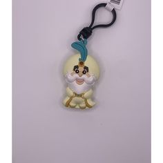 a keychain with an image of snow white and the seven dwarfs on it