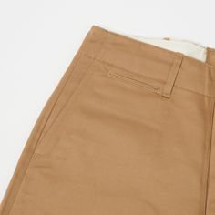 This 1945 military chino from Japan’s Buzz Rickson’s is cut from a neatly woven 100% cotton, and is cut in a vintage loose/straight shape. With a high rise and plenty of length to play around with, this trouser is as comfortable as you would expect it to be. The generous leg opening allows for great freedom of movement, and breathability, while traditional trouser details add an element of formality. Classic side entry pockets are present on the front, while a hidden watch pocket, and welted bac Buzz Rickson, Trousers Details, Watch Pocket, Cotton Chinos, Freedom Of Movement, Care Label, Us Army, Inside Pocket, To Play