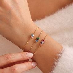 Elevate your style and celebrate life's special moments with our stunning Baguette Birthstone Bracelet. Crafted with exquisite baguette-cut birthstones, this bracelet is a beautiful expression of personal style and sentimentality. Each birthstone represents a special month, making this bracelet a perfect birthday gift or meaningful token for Mothers Day. Whether you choose to honor your own birth month or those of your loved ones, this personalized bracelet is sure to become a cherished keepsake Affordable Adjustable Birthstone Charm Bracelet, Adjustable Charm Bracelet With Birthstone, Adjustable Birthstone Charm Bracelet, Cubic Zirconia Bracelets For May Birthstone Gift, Gold Crystal Bracelet For May Birthstone Gift, Adjustable Crystal Bracelet With Stones As Gift, Elegant Cubic Zirconia Bracelet For Birthday, Gold Crystal Birthstone Bracelet As Gift, Cubic Zirconia Charm Bracelet With Adjustable Chain