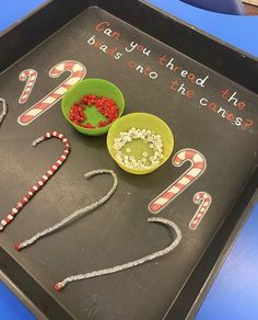 a tray that has some candy canes in it