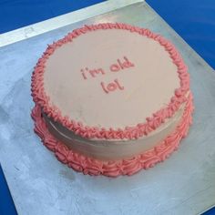 there is a cake that has been decorated with pink icing and writing on it